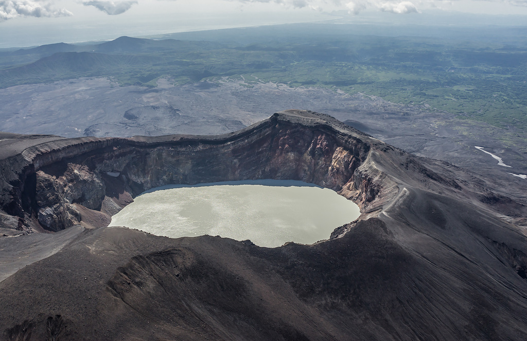 Maly Semyachik is a restless stratovolcano with a short 3,000 meters (9,843 feet) long ridge of thre...